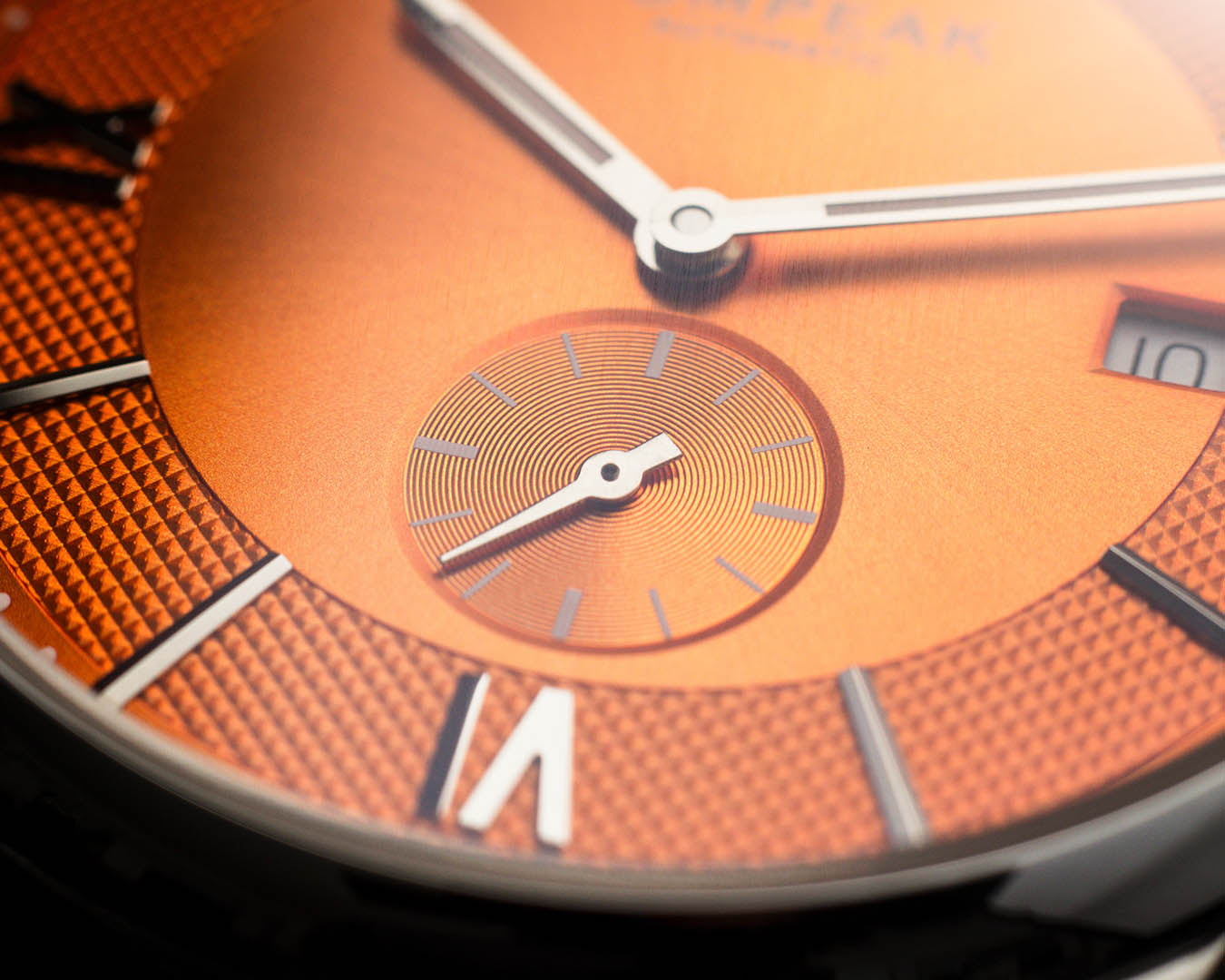 Close-up of the sub-seconds dial on the Mallory Orange Crush watch, featuring applied indices and intricate dial texture.