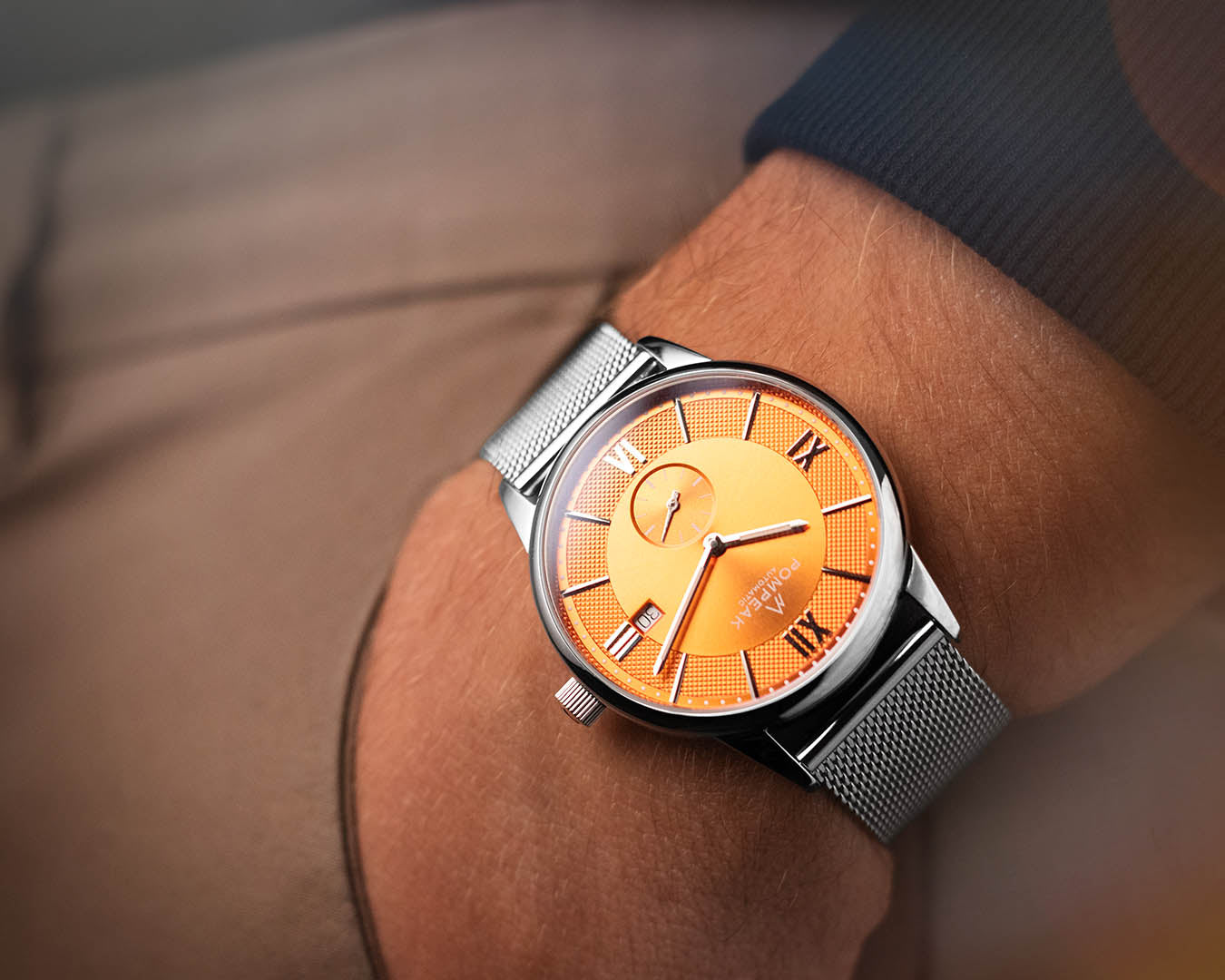 Mallory Orange Crush Swiss automatic watch on a 316L stainless steel Milanese mesh strap for a refined, modern look.