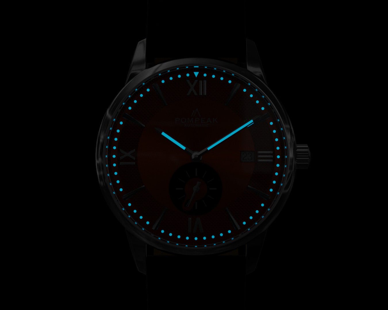 BGW9 Super-LumiNova glowing on the Mallory Orange Crush watch, delivering a mint blue luminescence for nighttime visibility.
