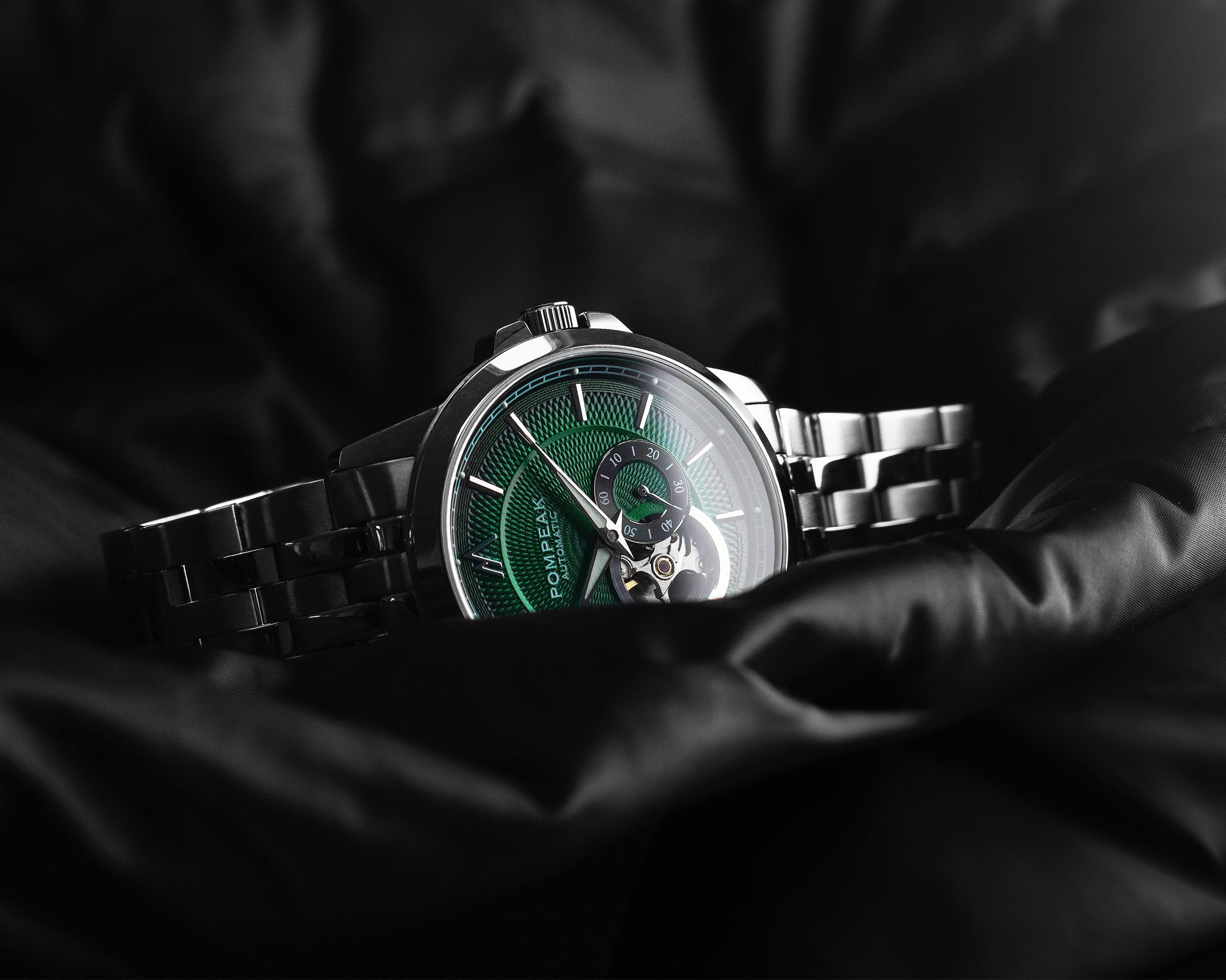 An exquisite shot of the British Racing Green edition watch, emphasizing its rich green hue and intricate dial pattern.