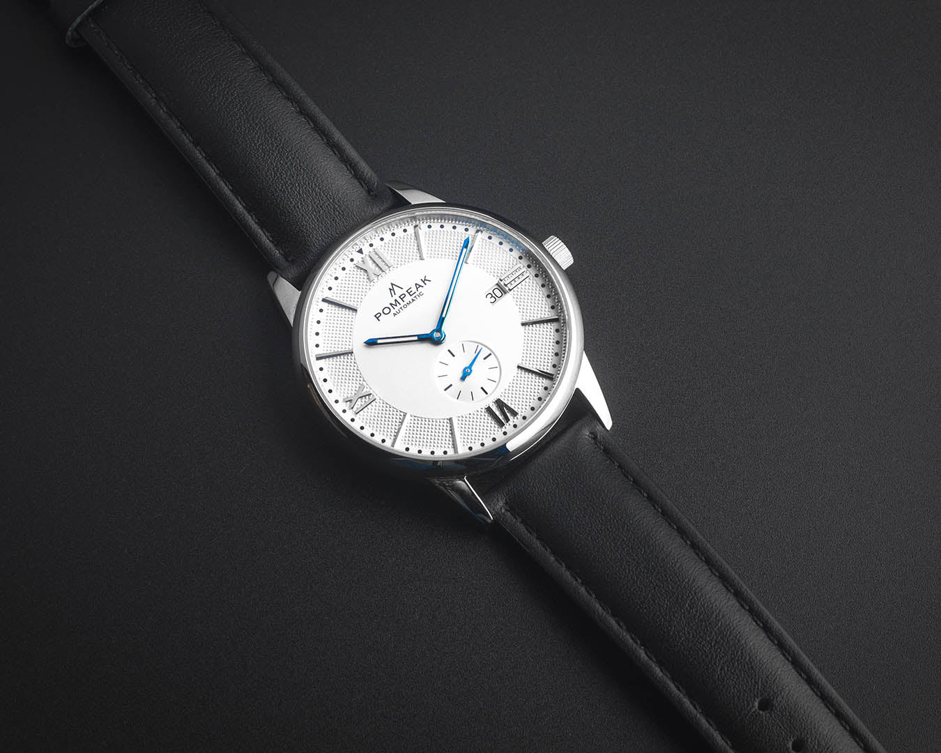 Mallory Timeless White Swiss automatic watch on a black top-grain leather strap, combining classic elegance with modern craftsmanship.