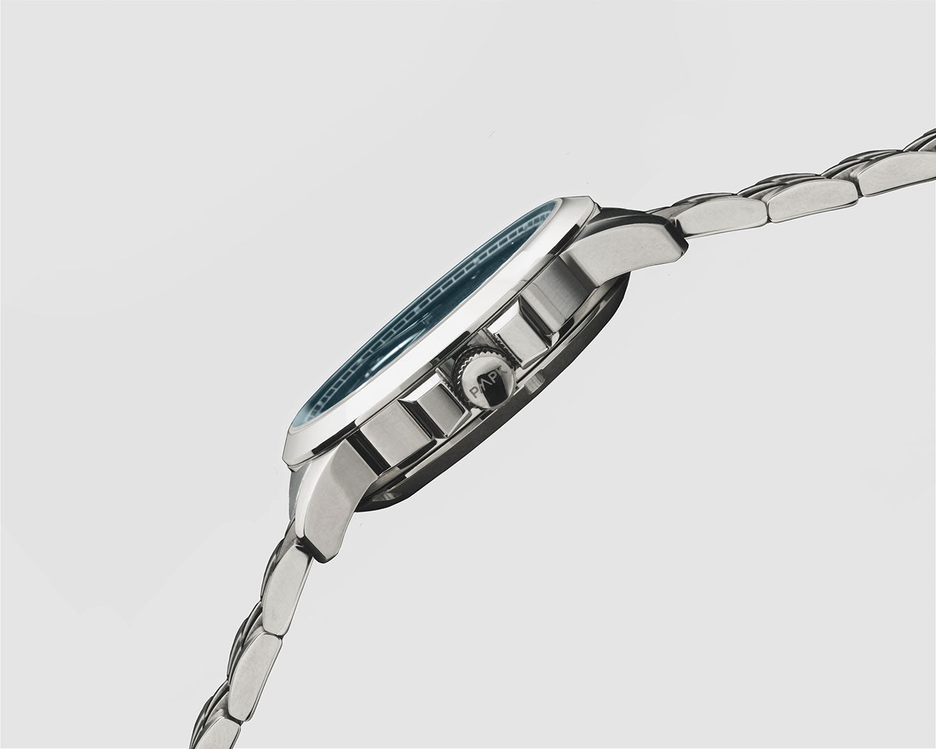 Silver Pompeak watch with a blue face on a light gray background