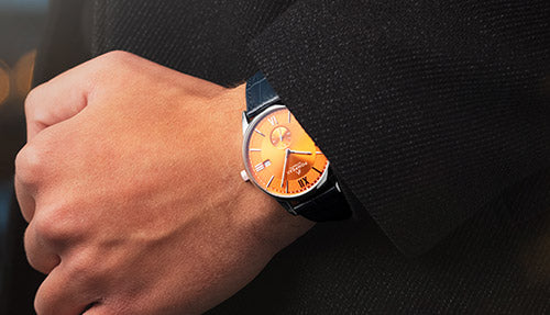 Pompeak Mallory with Orange sunburst dial and blue leather strap.