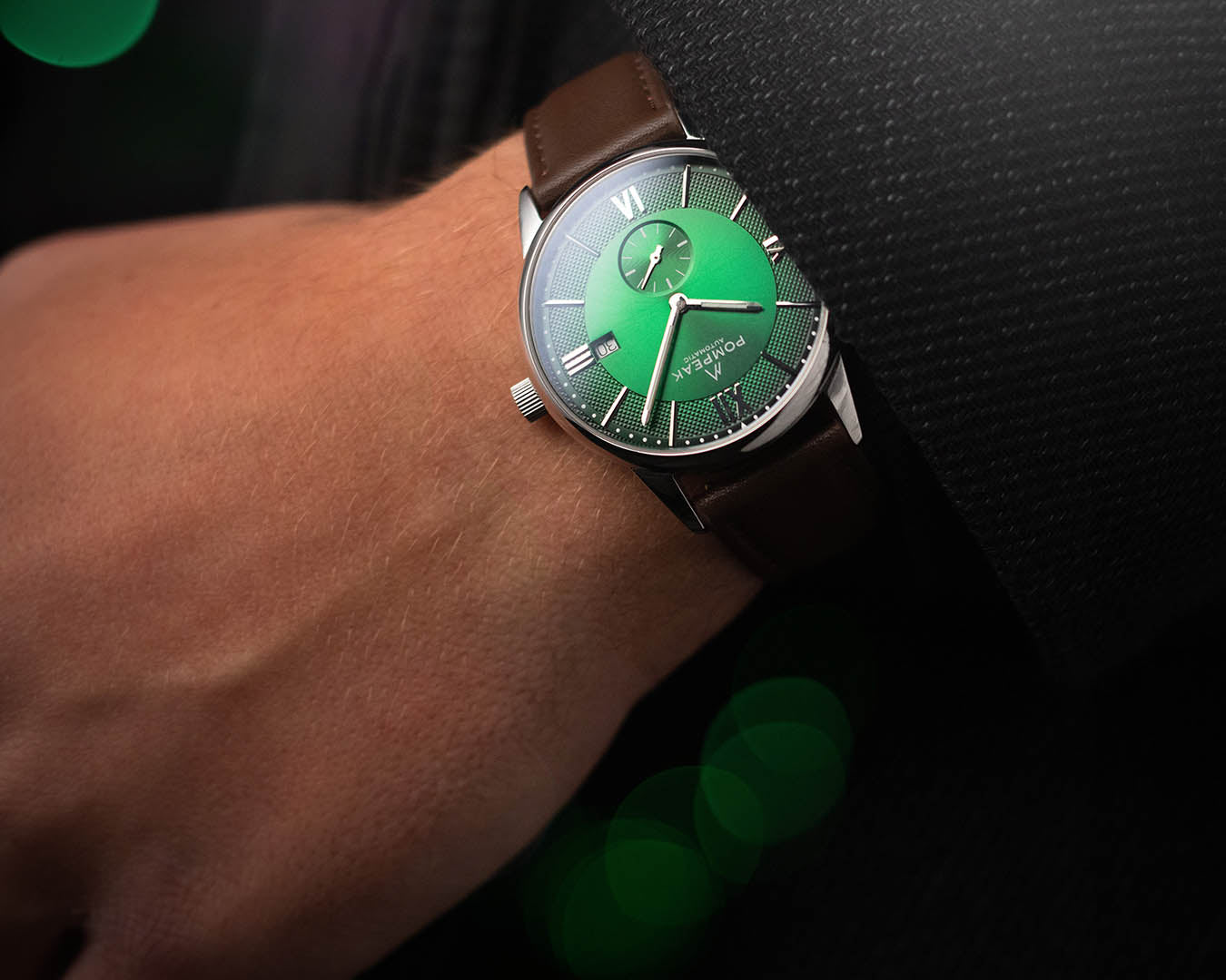 Mallory British Racing Green Swiss automatic watch worn on a brown leather strap, showcasing its sophisticated vintage-inspired style.