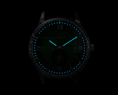 Mallory British Racing Green watch glowing in the dark with BGW9 Super-LumiNova, emitting a crisp mint blue light for night-time visibility.