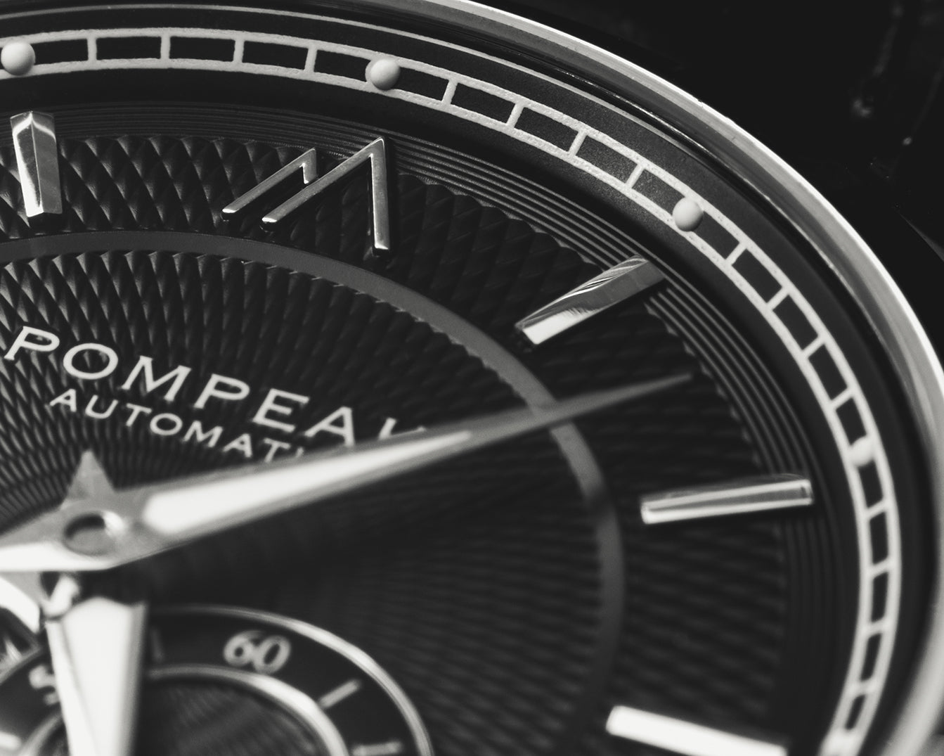 Pompeak automatic watch macro dial image.